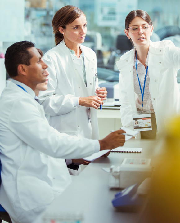 lab technicians working in custom biotech lab buildout in Ann Arbor