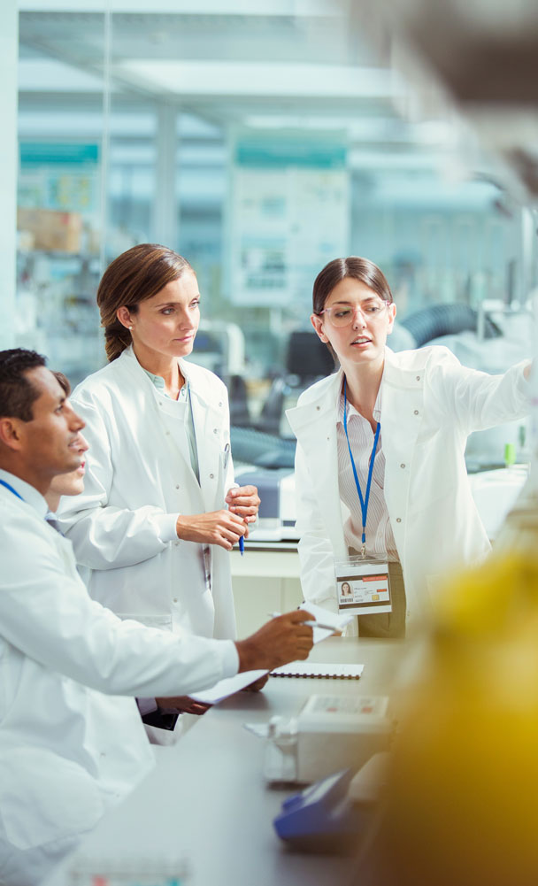 lab technicians working in custom biotech lab buildout in Ann Arbor